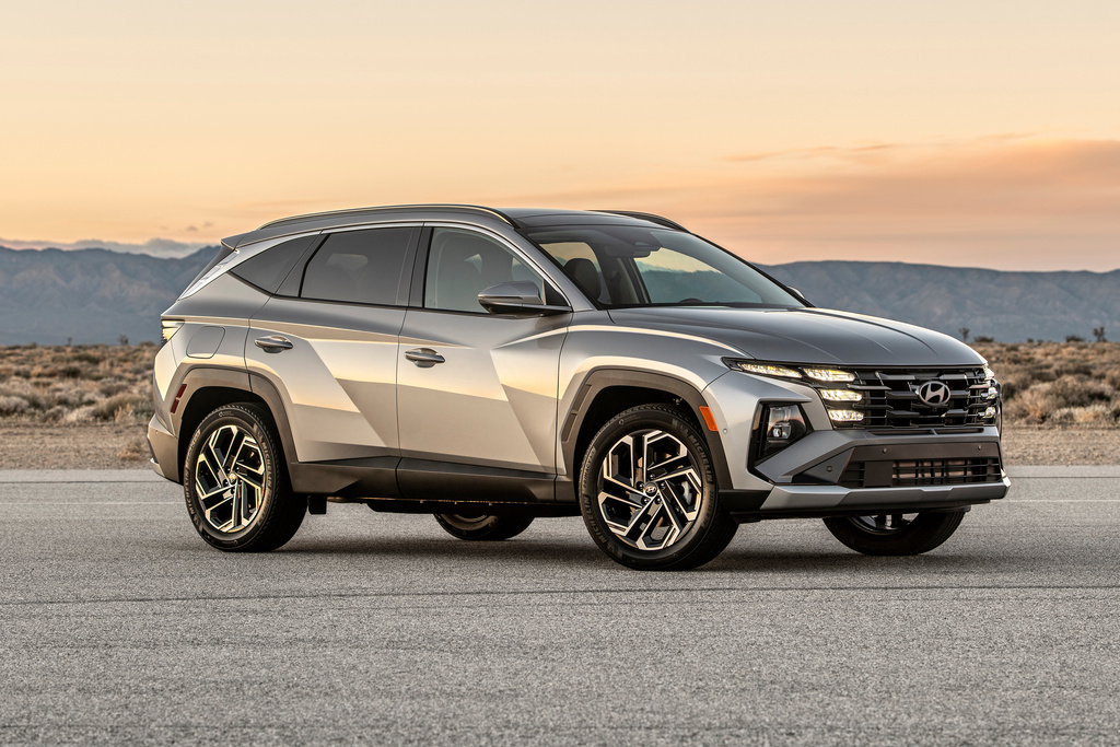 This photo provided by Hyundai shows the Tucson Plug-in Hybrid, a plug-in with excellent cargo space and good electric-only range. (Drew Phillips/Hyundai Motor America via AP)