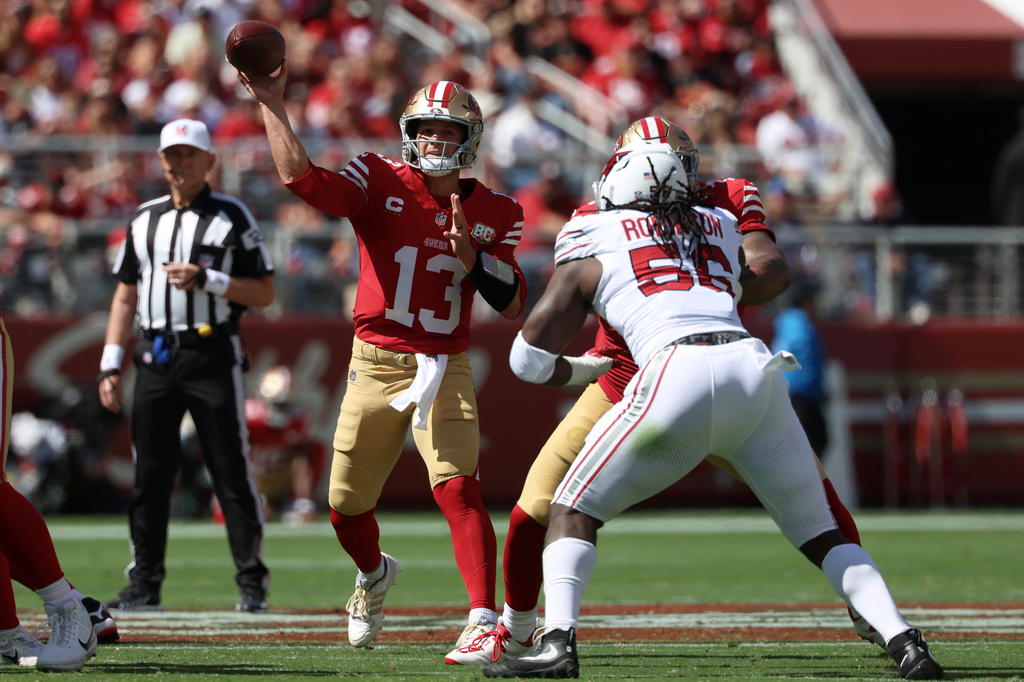 San Francisco 49ers quarterback Brock Purdy (13) passes against the Arizona Cardinals during the first half of an NFL football game in Santa Clara, Calif., Sunday, Sept. 27, 2026. (AP Photo/Jed Jacobsohn)