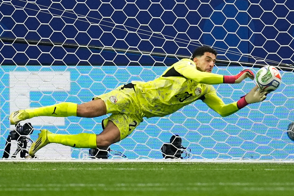 Egypt goalkeeper Mostafa Shoubir (23) saves a penalty kick from Argentina's Lionel Messi (10) during the World Cup round of 16 soccer match between Argentina and Egypt in Atlanta, Tuesday, July 7, 2026. (AP Photo/Mike Stewart)