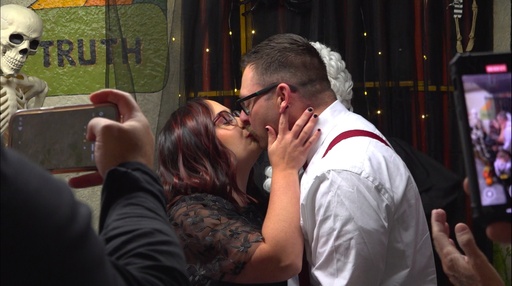 This photo made from video shows Nicole Bond, left, and Jacob Beatty kissing after a judge marries them at the Historic Jail and Sheriff's Residence on Friday, Oct. 31, 2025, in Delaware, Ohio. (AP Photo/Patrick Aftoora-Orsagos) This photo made from video shows Nicole Bond, left, and Jacob Beatty kissing after a judge marries them at the Historic Jail and Sheriff's Residence on Friday, Oct. 31, 2025, in Delaware, Ohio. (AP Photo/Patrick Aftoora-Orsagos)