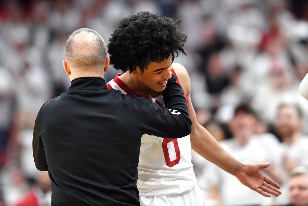 Louisville head coach Pat Kelsey hugs guard Mikel Brown Jr. (0) following his 45 point performance during the second half of an NCAA college basketball game against North Carolina State in Louisville, Ky., Monday, Feb. 9, 2026. (AP Photo/Timothy D. Easley)