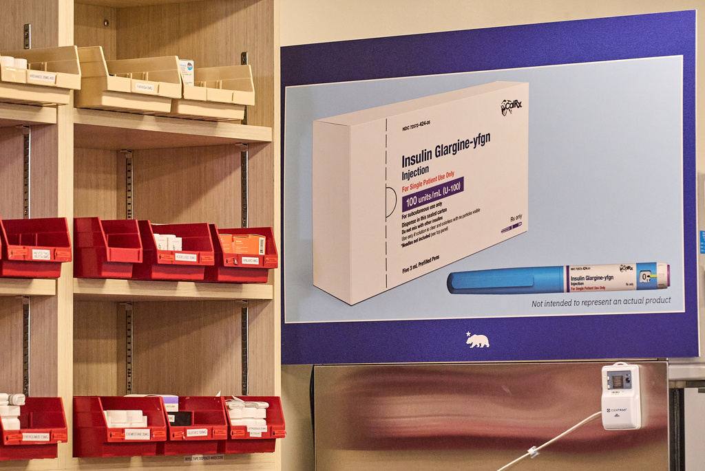 A composite for the upcoming CalRx-branded Insulin Glargine pens available next Jan. 1, 2026, at a suggested retail price of no more than $55 per five-pack, or $11 per pen, is displayed at during a Gov. Gavin Newson's news conference at Cedar-Sinai's Mark Goodson pharmacy in Los Angeles, Thursday, Oct. 16, 2025. (AP Photo/Damian Dovarganes)