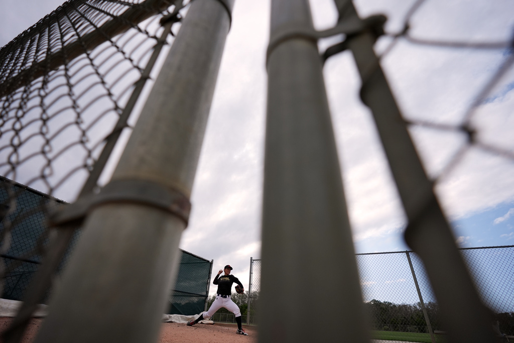 Ayami Sato pitches during a Women's Pro Baseball League (WPBL) practice, Wednesday, March 18, 2026, in Fort Myers, Fla. (AP Photo/Rebecca Blackwell)