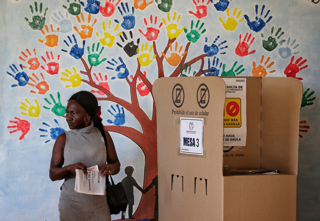 A woman votes during legislative elections in Buenos Aires, Cauca state, Colombia, Sunday, March 8, 2026. (AP Photo/Santiago Saldarriaga)