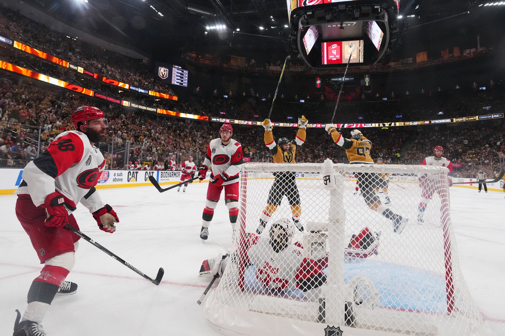 Carolina Hurricanes left wing Jordan Martinook (48) reacts after Vegas Golden Knights defenseman Shea Theodore scored during the the second overtime in Game 3 of the NHL hockey Stanley Cup Final series , Saturday, June 6, 2026, in Las Vegas. (AP Photo/Candice Ward)
