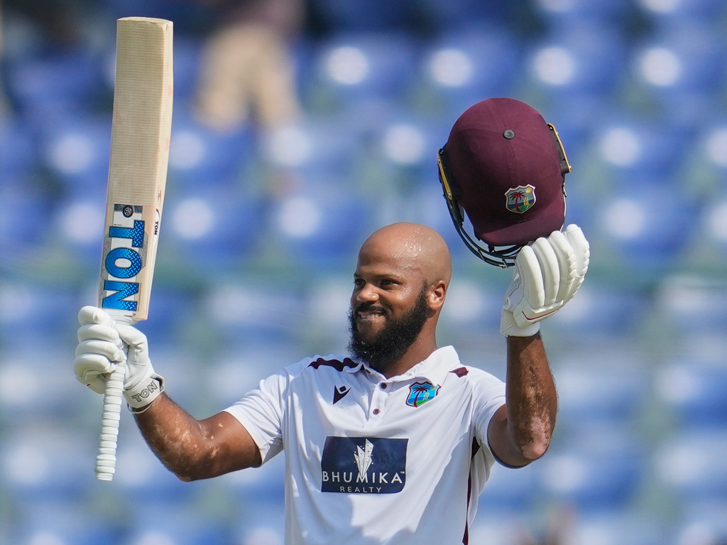 West Indies' John Campbell celebrates after scoring a century on the fourth day of the second cricket test match between India and West Indies at the Arun Jaitley Stadium in New Delhi, India, Monday, Oct.13, 2025. (AP Photo/Manish Swarup)