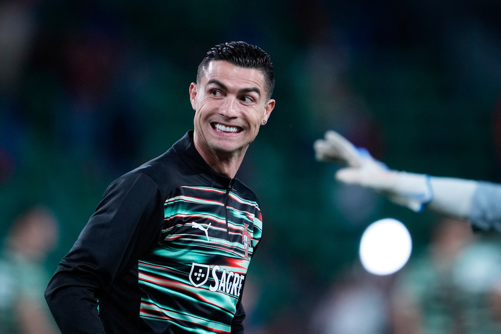 FILE - Portugal's Cristiano Ronaldo smiles during warmup before a World Cup 2026 group F qualifying soccer match between Portugal and Hungary in Lisbon, on Oct. 14, 2025. (AP Photo/Armando Franca, File)