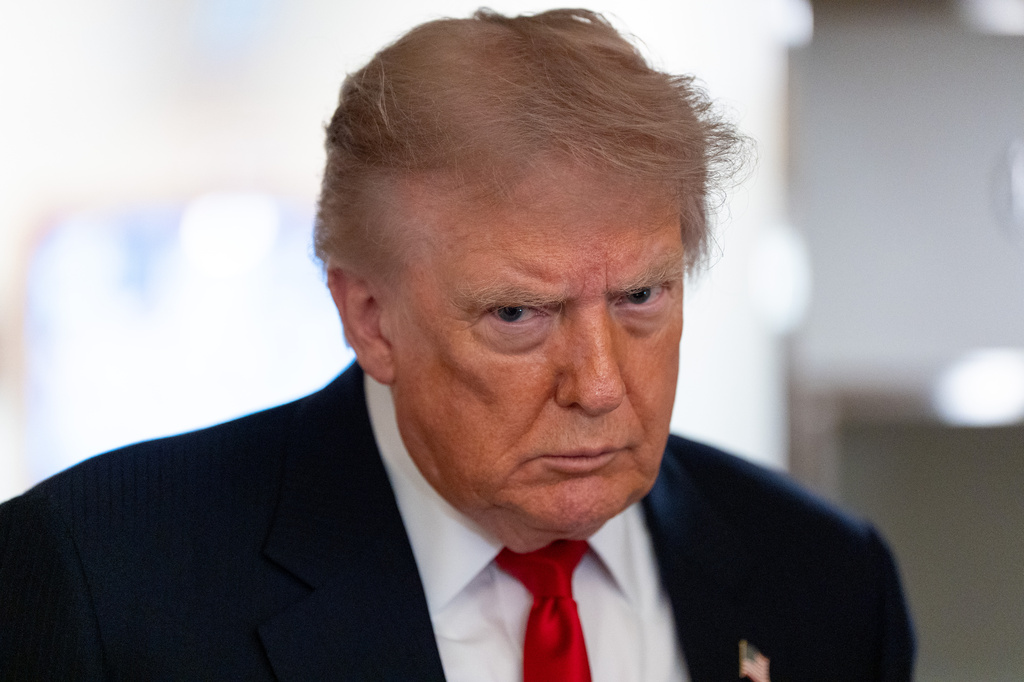 FILE - President Donald Trump speaks with reporters while on Air Force One en route to Oakland County International Airport, July 27, 2026, in Waterford Township, Mich. (AP Photo/Alex Brandon, File)