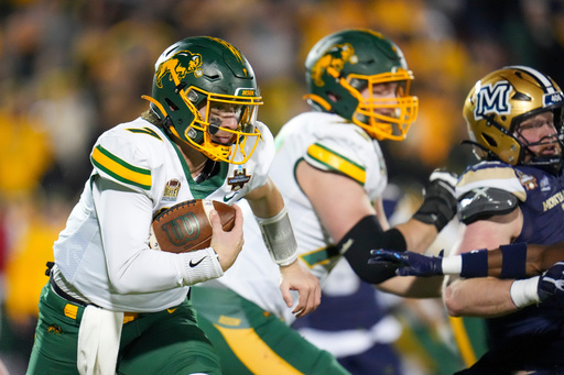 FILE - North Dakota State quarterback Cam Miller runs with the ball against Montana State during the first half of the FCS Championship NCAA college football game, Jan. 6, 2025, in Frisco, Texas. (AP Photo/Julio Cortez, File) FILE - North Dakota State quarterback Cam Miller runs with the ball against Montana State during the first half of the FCS Championship NCAA college football game, Jan. 6, 2025, in Frisco, Texas. (AP Photo/Julio Cortez, File)