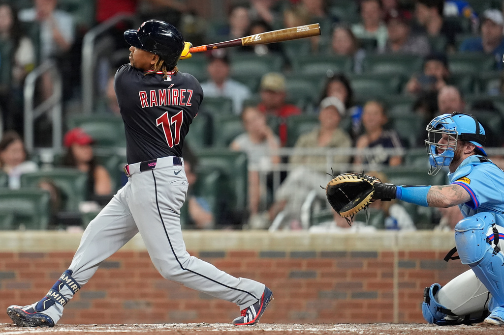 Cleveland Guardians' José Ramírez (11) hits a single in the sixth inning of a baseball game against the Atlanta Braves, Saturday, April 11, 2026, in Atlanta. (AP Photo/Mike Stewart)