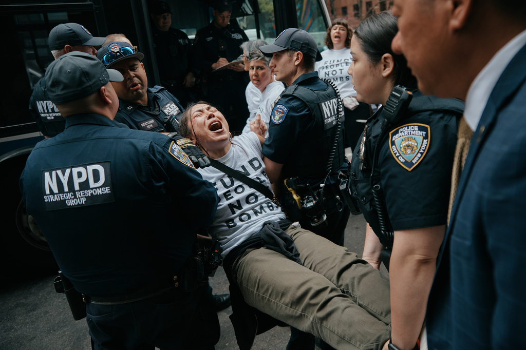 Protesters with Jewish Voice for Peace get arrested after blocking traffic during a demonstration outside the New York office of U.S. Sen. Chuck Schumer, calling for an end to the U.S.-Israel war with Iran and opposing U.S. weapons support on Monday, April 13, 2026, in New York. (AP Photo/Andres Kudacki)