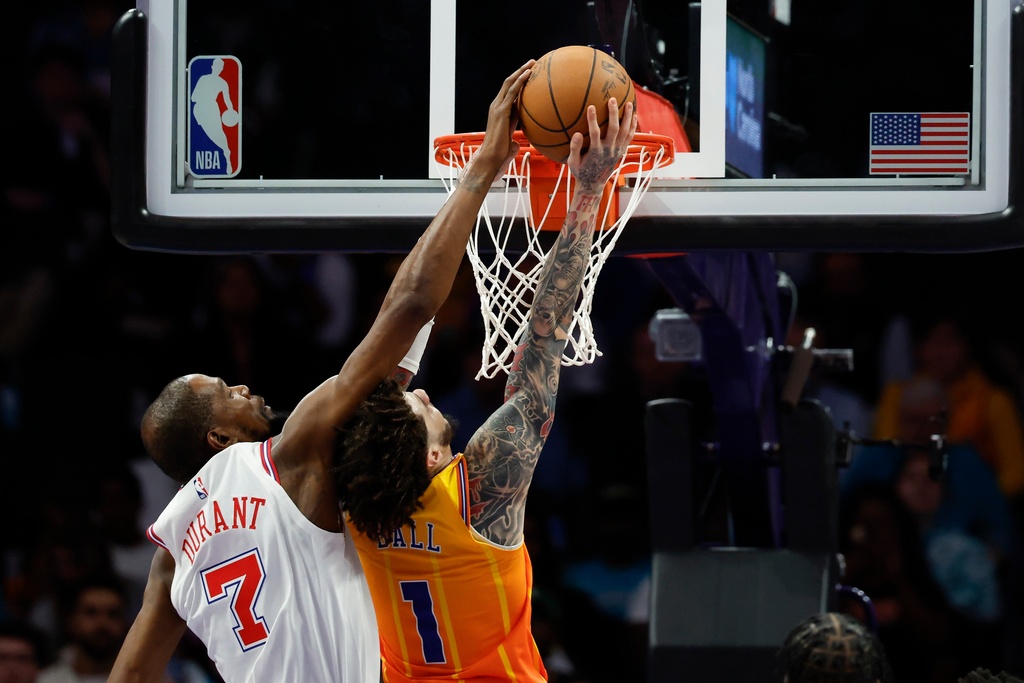 Houston Rockets forward Kevin Durant (7) blocks a shot attempt by Charlotte Hornets guard LaMelo Ball during the first half of an NBA basketball game in Charlotte, N.C., Thursday, Feb. 19, 2026. (AP Photo/Nell Redmond)