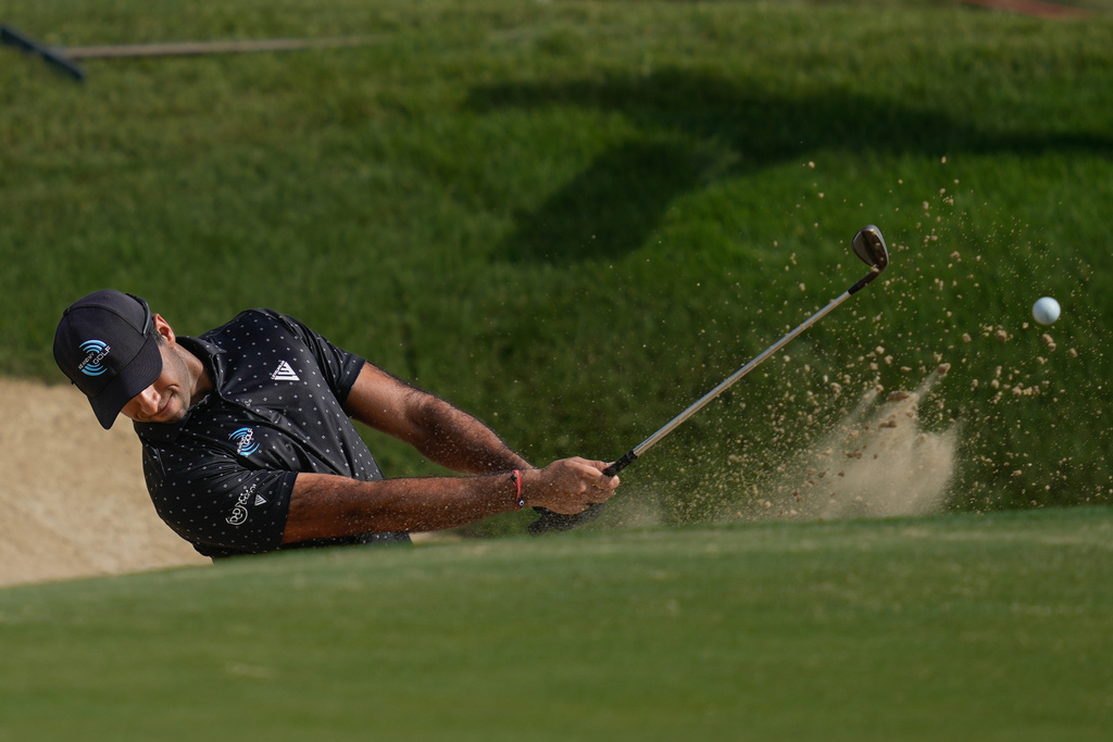Aaron Rai of England hits a shot from a bunker on the 7th hole during the third round of the Abu Dhabi Golf Championship in Abu Dhabi, United Arab Emirates, Saturday, Nov. 8, 2025. (AP Photo/Altaf Qadri)