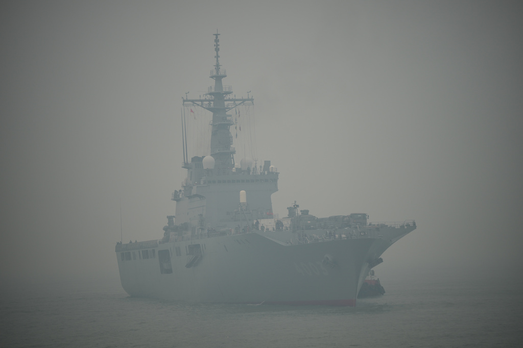 Japanese tank landing ship JS Kunisaki approaches Kijing Port amid the thick haze from forest fires in Mempawah, West Kalimantan, Indonesia, Thursday, Sept. 10, 2026. (AP Photo/Tatan Syuflana)