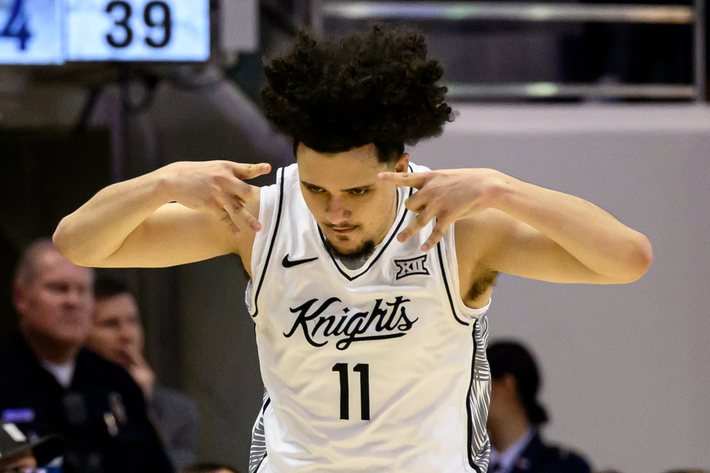 UCF guard Carmelo Pacheco celebrates after making a 3-point shot during the first half an NCAA college basketball game against BYU, Tuesday, Feb. 24, 2026, in Provo, Utah. (AP Photo/Tyler Tate)