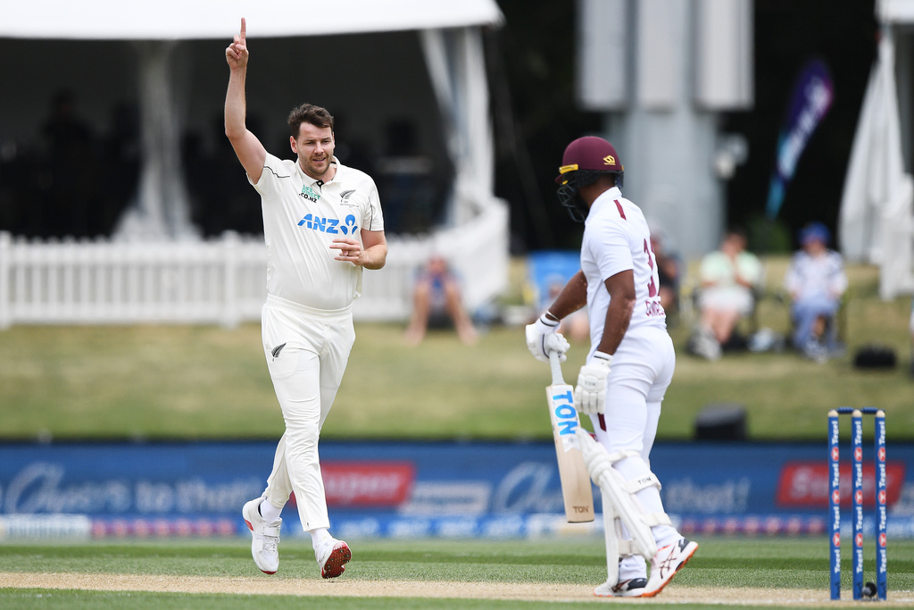 New Zealand's Jacob Duffy, left, celebrates after taking the wicket of the West Indies' John Campbell, right, on Day 4 of their cricket test match in Christchurch, New Zealand, Friday, Dec. 5, 2025. (Chris Symes/Photosport via AP)