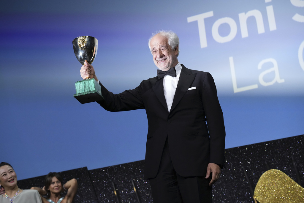 Toni Servillo accepts the Coppa Volpi award for best actor for 'La Grazia' during the awards ceremony of the 82nd edition of the Venice Film Festival in Venice, Italy, on Saturday, Sept. 6, 2025. (Photo by Alessandra Tarantino/Invision/AP)
