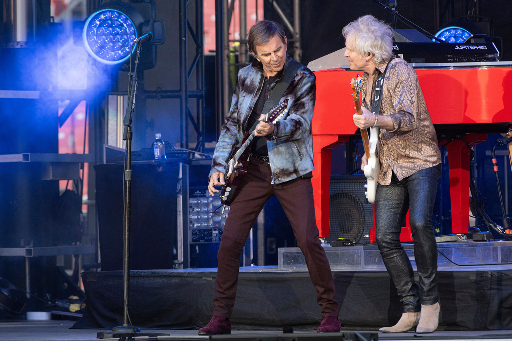 FILE - Journey guitarists Jonathan Cain, left, and Todd Jensen perform at the Cleveland Browns NFL football draft party in Cleveland, on April 24, 2025. (AP Photo/Phil Long, File)