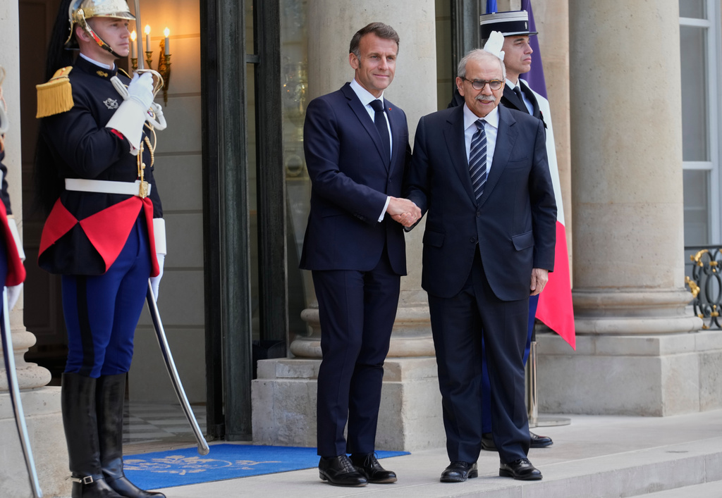 France's President Emmanuel Macron, left, welcomes Lebanon's Prime Minister Nawaf Salam for a meeting at the Elysee Palace in Paris, Tuesday, April 21, 2026. (AP PhotoMichel Euler)