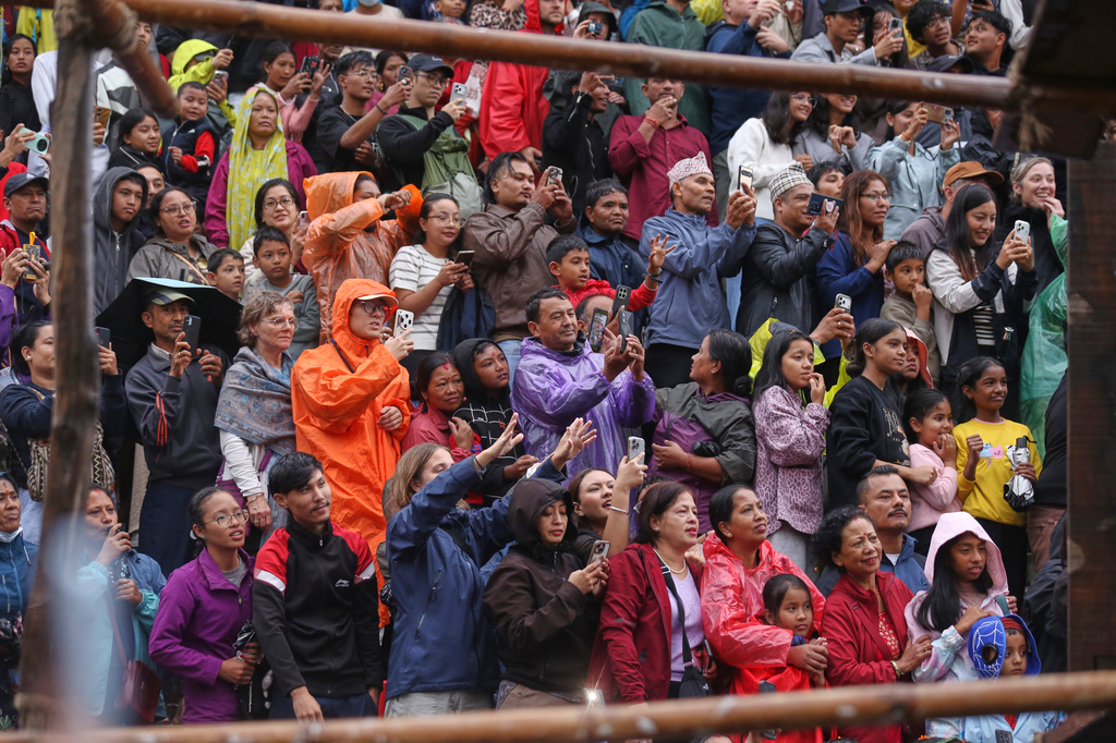 People gather to watch the annual Indra Jatra festival that marks the end of the rainy season in Kathmandu, Nepal, Friday, Sept. 25, 2026. (AP Photo/Subash Shrestha)