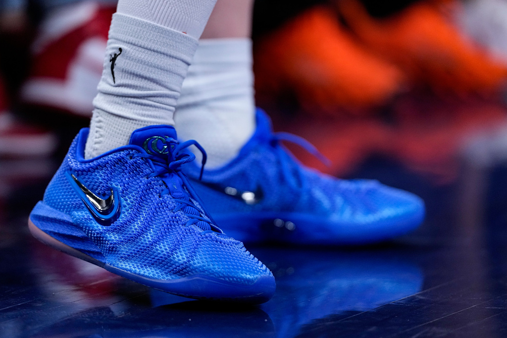 The shoes worn by Indiana Fever guard Caitlin Clark (22) are shown in the first half of a WNBA basketball game against the Atlanta Dream in Indianapolis, Thursday, June 18, 2026. (AP Photo/Michael Conroy)
