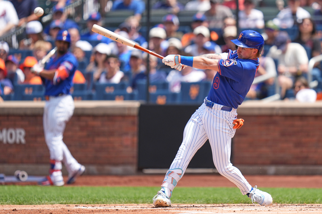 New York Mets' A.J. Ewing hits a two-run double during the first inning of a baseball game against the Atlanta Braves, Sunday, June 14, 2026, in New York. (AP Photo/Seth Wenig)