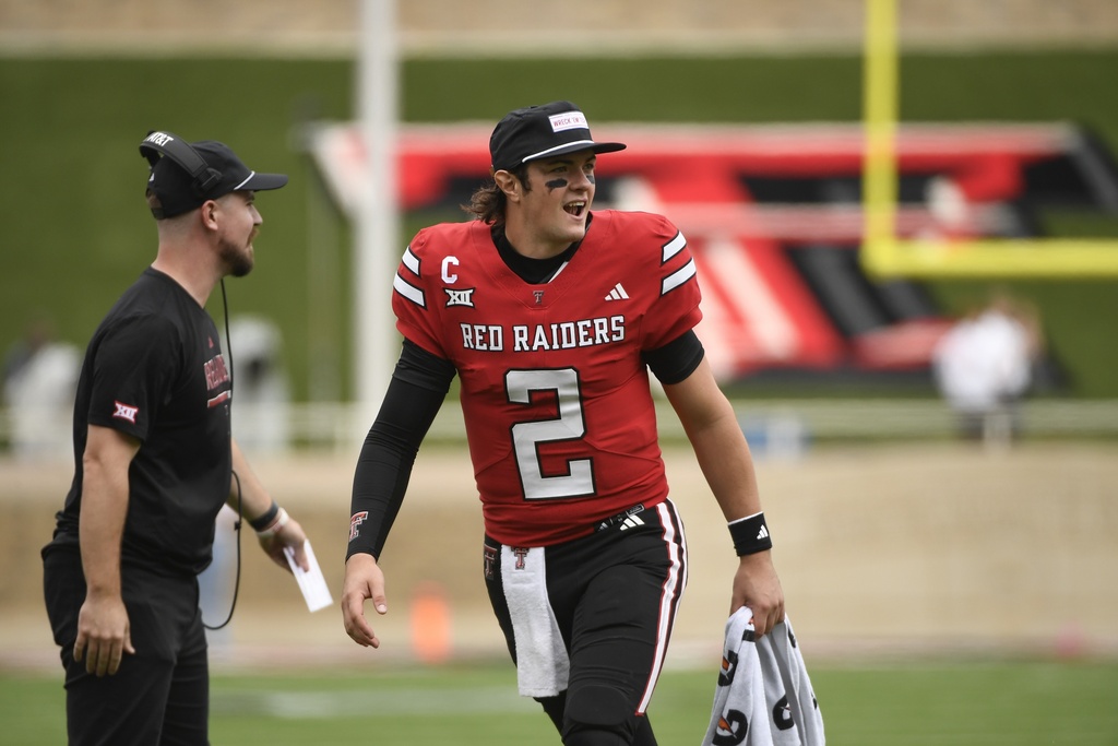 Texas Tech quarterback Behren Morton (2) reacts to a touchdown after being taken out during the second half of an NCAA college football game against Kent State Saturday, Sept. 6, 2025, in Lubbock, Texas. (AP Photo/Justin Rex)