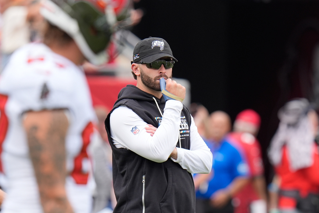 Tampa Bay Buccaneers quarterback Baker Mayfield walks the sidelines with a cast on his right thumb before an NFL football game against the Green Bay Packers in Tampa, Fla., Sunday, Oct. 4, 2026. (AP Photo/Chris O'Meara)