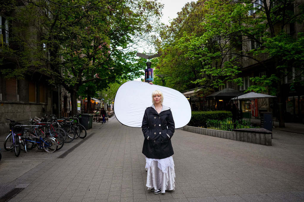 Andrea Anna Hajdu, 22, poses for a portrait in Budapest, Hungary, Monday, April 13, 2026. "This whole movement started with us, with student protests. They couldn't lead us on. We were hungry for change." (AP Photo/Petr David Josek)
