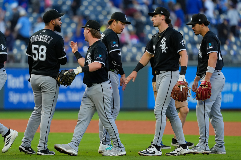Chicago White Sox players celebrate after their baseball game against the Kansas City Royals, Sunday, April 12, 2026, in Kansas City, Mo. (AP Photo/Charlie Riedel)