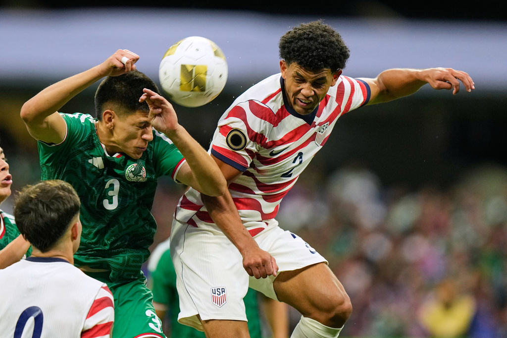 United States' Brandon Dayesr, right, heads the ball next to Mexico's Cristóbal Alfaro during the CONCACAF U-20 final soccer match in Mexico City, Sunday, Aug. 9, 2026. (AP Photo/Fernando Llano)