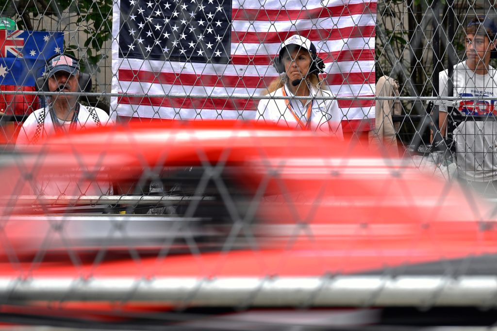 A race track official observes a car participating in a practice run for the IROC auto race, Saturday, Aug. 22, 2026, in Washington. (AP Photo/John McDonnell)