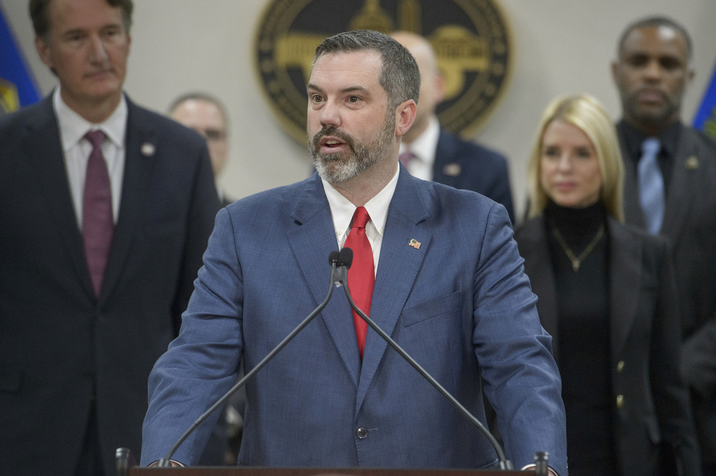 FILE - Erik Siebert, interim U.S. Attorney for the eastern district of Virginia, speaks as Attorney General Pam Bondi, right, and Virginia Gov. Glenn Youngkin, left, listen during a news conference at the Manassas FBI Field Office, March 27, 2025, in Manassas, Va. (AP Photo/Rod Lamkey, Jr., File)