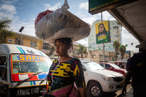 Pedestrians walk past a billboard for Tanzanian presidential candidate Samia Suluhu Hassan, of the ruling Chama Cha Mapinduzi party, in Arusha, Tanzania, Oct. 8, 2025. (AP Photo) Pedestrians walk past a billboard for Tanzanian presidential candidate Samia Suluhu Hassan, of the ruling Chama Cha Mapinduzi party, in Arusha, Tanzania, Oct. 8, 2025. (AP Photo)