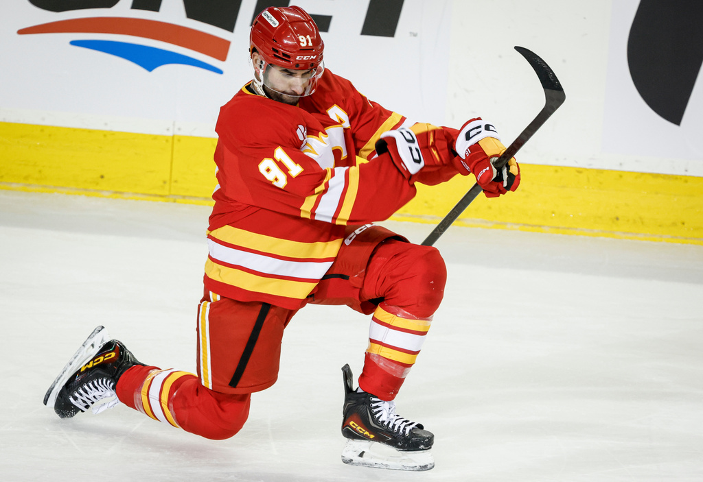 Calgary Flames' Nazem Kadri celebrates after his goal during third-period NHL hockey game action against the Seattle Kraken in Calgary, Alberta, Thursday, Dec. 18, 2025. (Jeff McIntosh/The Canadian Press via AP)