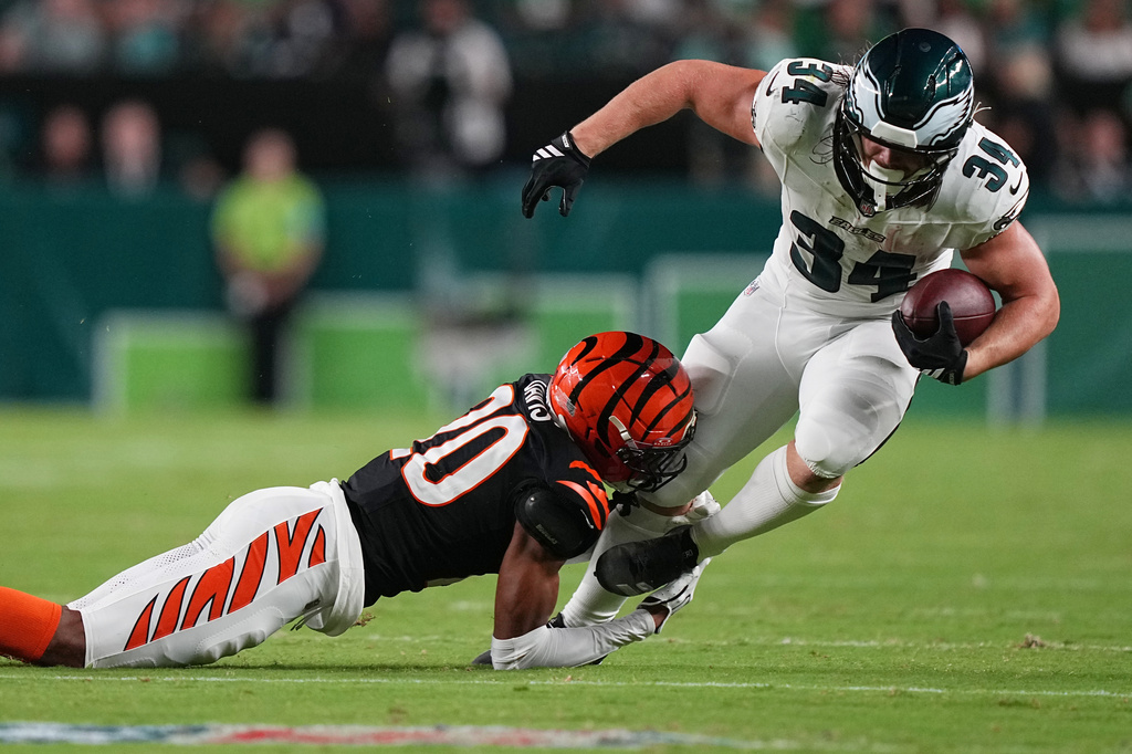 Philadelphia Eagles running back Carson Steele (34) is stopped by Cincinnati Bengals defensive back Tacario Davis (20) during the first half of a preseason NFL football game Friday, Aug. 28, 2026, in Philadelphia. (AP Photo/Matt Rourke)