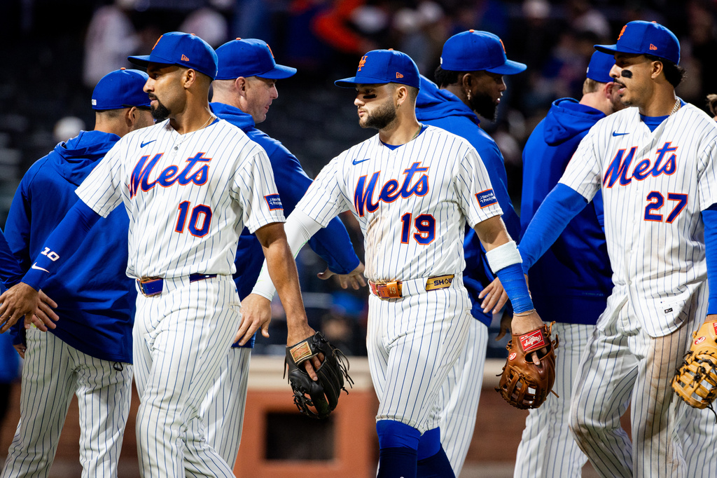New York Mets celebrate their 8-0 win against the Washington Nationals after a baseball game, Tuesday, April 28, 2026, in New York. (AP Photo/Angelina Katsanis)