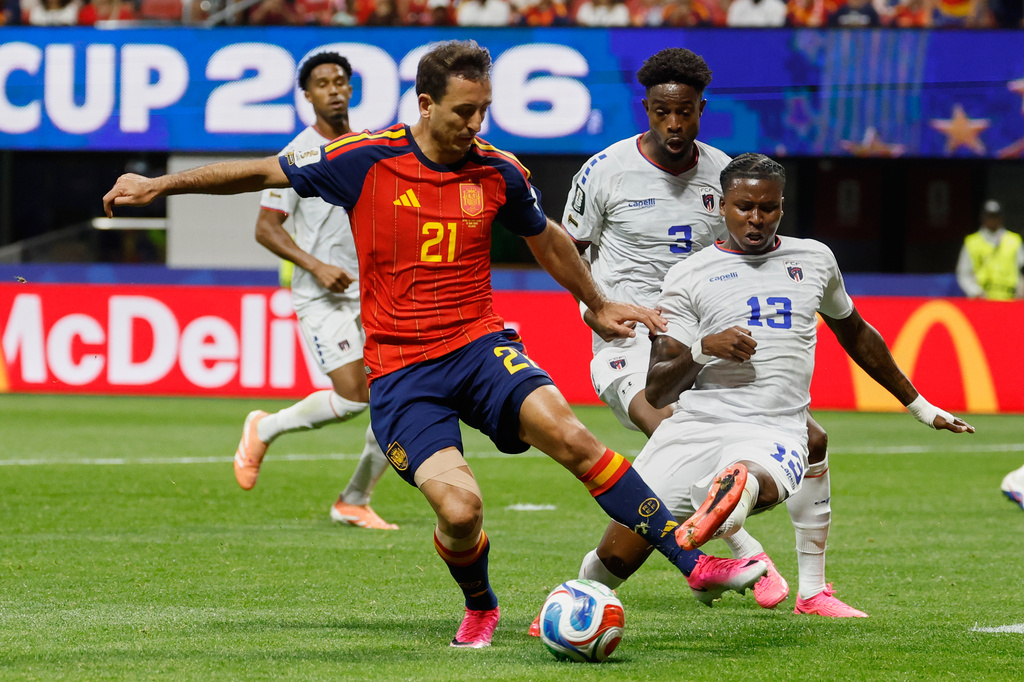 Spain's Mikel Oyarzabal, left, and Cabo Verde's Sidny Lopes Cabral fight for the ball during the World Cup Group H soccer match between Spain and Cape Verde in Atlanta, Monday, June 15, 2026. (AP Photo/Erik S. Lesser)