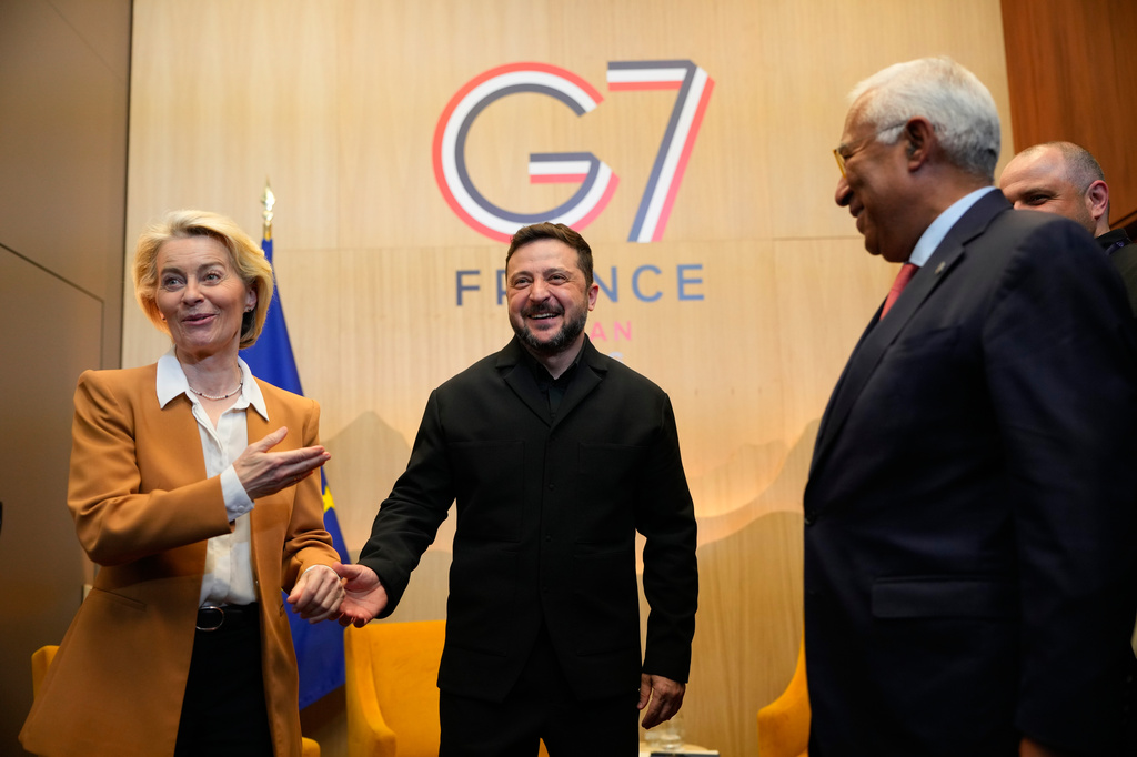 Ukrainian President Volodymyr Zelenskyy, center, meets with European Commission President Ursula von der Leyen, left, and European Council President Antonio Costa, right, at the G7 summit in Evian-les-Bains, France, Tuesday, June 16, 2026. (AP Photo/Vadim Ghirda)