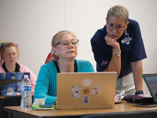 Northside American Federation of Teachers President Melina Espiritu-Azocar, right, speaks with middle school teacher Celeste Simone during a Microsoft AI skilling event, Saturday, Sept. 27, 2025, in San Antonio. (AP Photo/Darren Abate) Northside American Federation of Teachers President Melina Espiritu-Azocar, right, speaks with middle school teacher Celeste Simone during a Microsoft AI skilling event, Saturday, Sept. 27, 2025, in San Antonio. (AP Photo/Darren Abate)