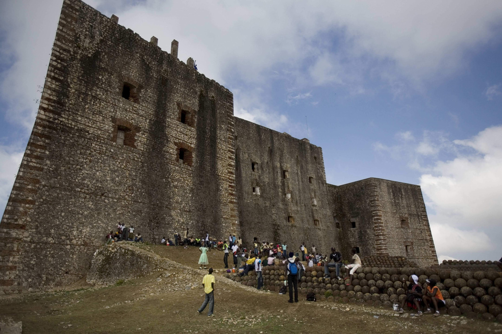 FILE - Visitors tour the Citadelle Laferriere in Milot, Haiti, Thursday, March 27, 2008. (AP Photo/Ariana Cubillos, FILE)