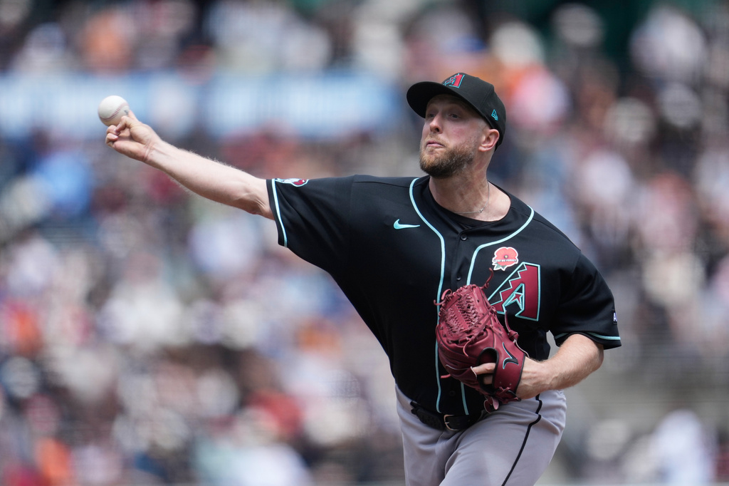 Arizona Diamondbacks pitcher Merrill Kelly throws against the San Francisco Giants during the first inning of a baseball game Monday, May 25, 2026, in San Francisco. (AP Photo/Jeff Chiu)