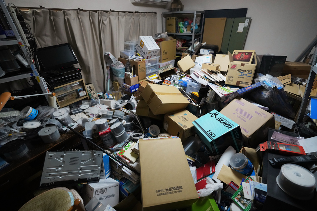 Kiyoshi Matsunaga, a local resident of Kumamoto, southwestern Japan, shows a damaged room of his home Wednesday, July 29, 2026, the day after an earthquake hit the area. (AP Photo/Hiro Komae)