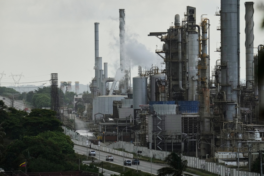 FILE - Vehicles drive past the El Palito refinery in Puerto Cabello, Venezuela, Sunday, Dec. 21, 2025. (AP Photo/Matias Delacroix, file)