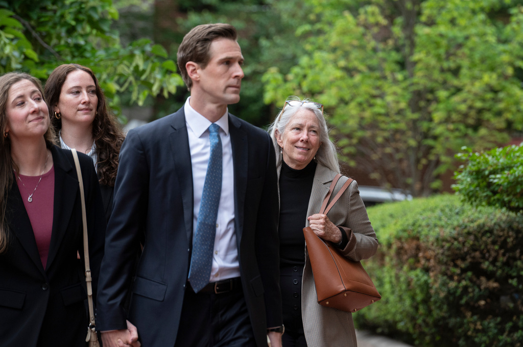 Patrice Failor, right, wife of former FBI Director James Comey, arrives, with family members, at the federal courthouse in Alexandria, Va., Wednesday, April 29, 2026. (AP Photo/Cliff Owen)