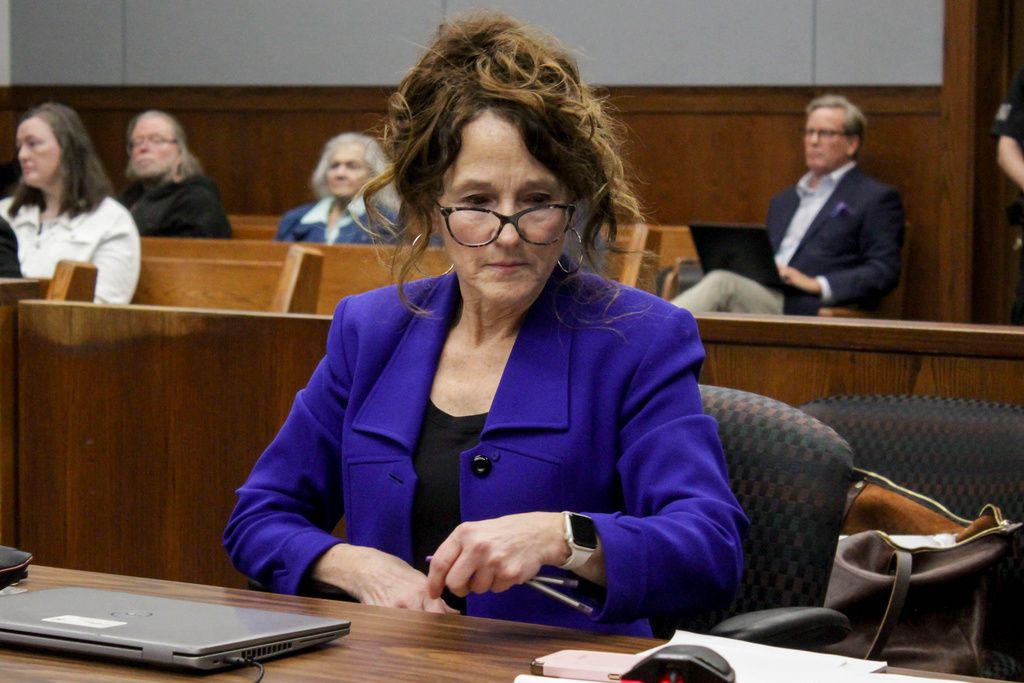 Washtenaw County assistant prosecutor Kati Rezmierski takes her seat as Sherrone Moore appears for a hearing, Friday, March 6 2026, at Washtenaw County 14A-1 District in Ann Arbor, Mich. (Jordyn Pair/Ann Arbor News via AP)