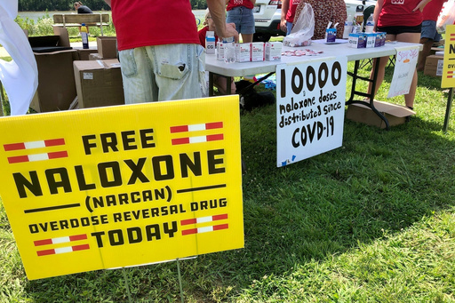 FILE - Signs are displayed at a tent during a health event June 26, 2021, in Charleston, W.Va. (AP Photo/John Raby, File) FILE - Signs are displayed at a tent during a health event June 26, 2021, in Charleston, W.Va. (AP Photo/John Raby, File)