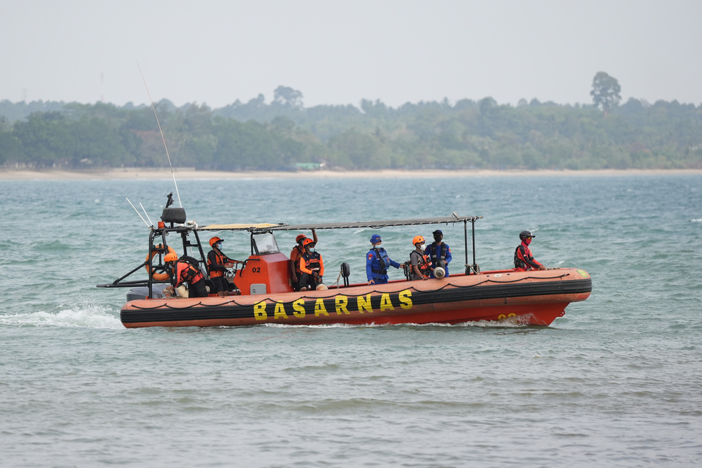 Rescuers ride on a rubber boat during the search for the journalists who went missing while covering the eruption of Mount Anak Krakatau, in Pandeglang, Indonesia, Wednesday, Sept. 9, 2026. (AP Photo/Dziki Oktomauliyadi)