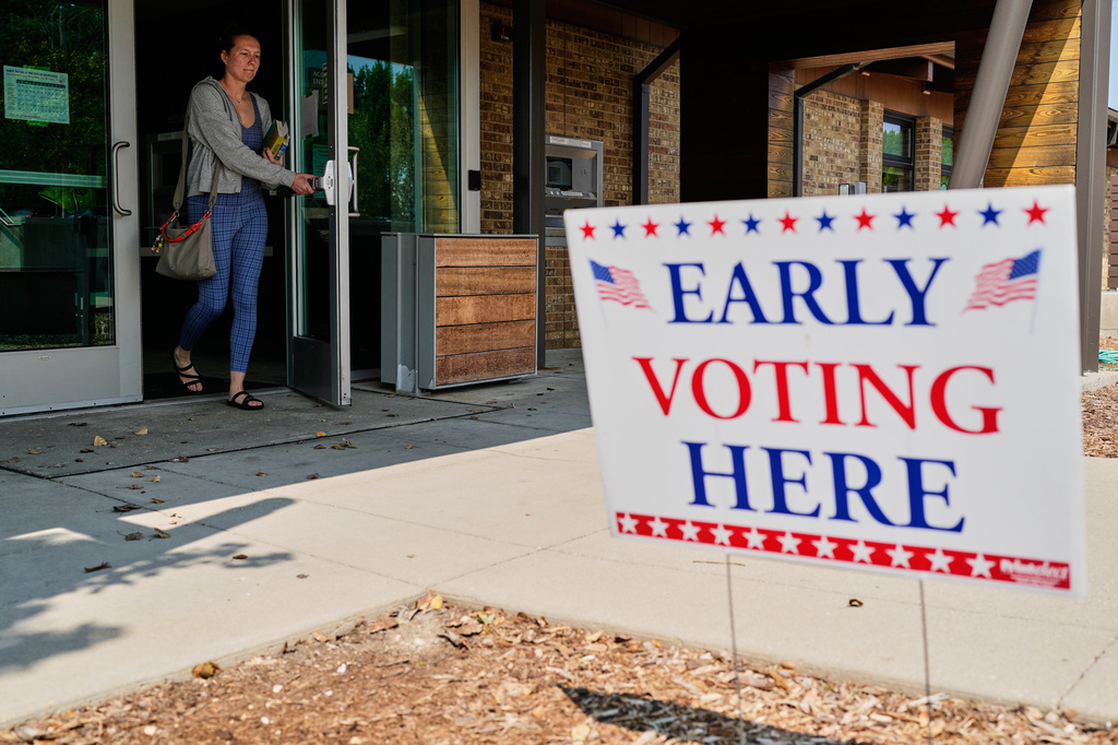 A voter walks out after voting at a polling place, Tuesday, July 28, 2026, in Milwaukee. (AP Photo/Nam Y. Huh)