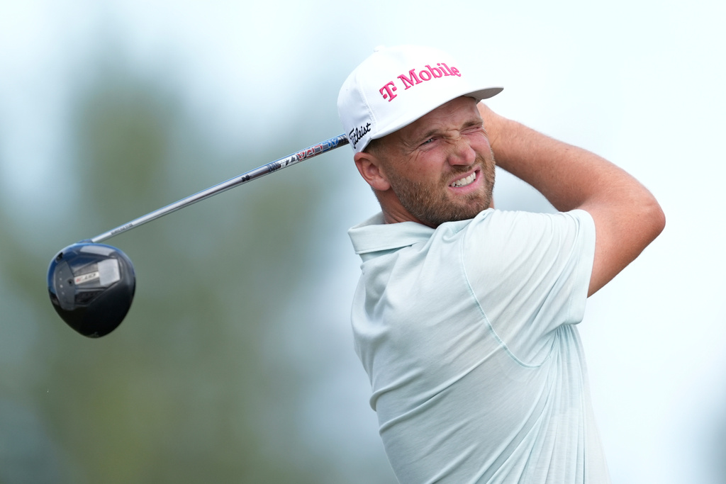 Wyndham Clark, of the United States, watches his shot on the third tee during the first round of the Hero World Challenge PGA Tour at the Albany Golf Club, in New Providence, Bahamas, Thursday, Dec. 4, 2025. (AP Photo/Fernando Llano)